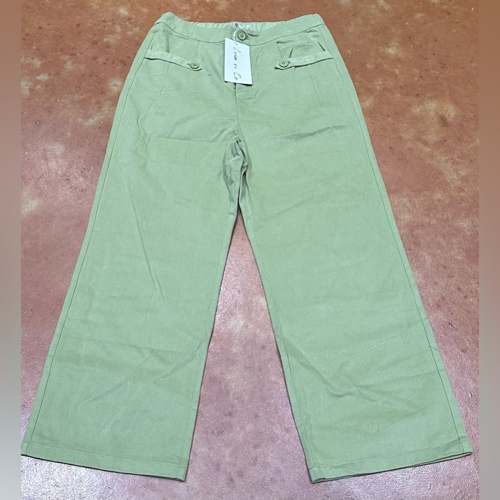 Nwt Boutique Sage Green Wide Leg Pant with pockets and elastic back for comfort.